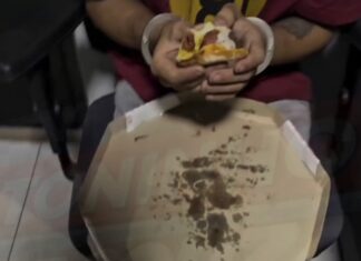 Veja Vídeo – Policial viraliza ao mostrar preso comendo pizza durante ocorrência